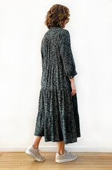 Geelong woman wearing Viscose Tiered Shirt Dress in green leopard print. This image is showing the back view of the dress