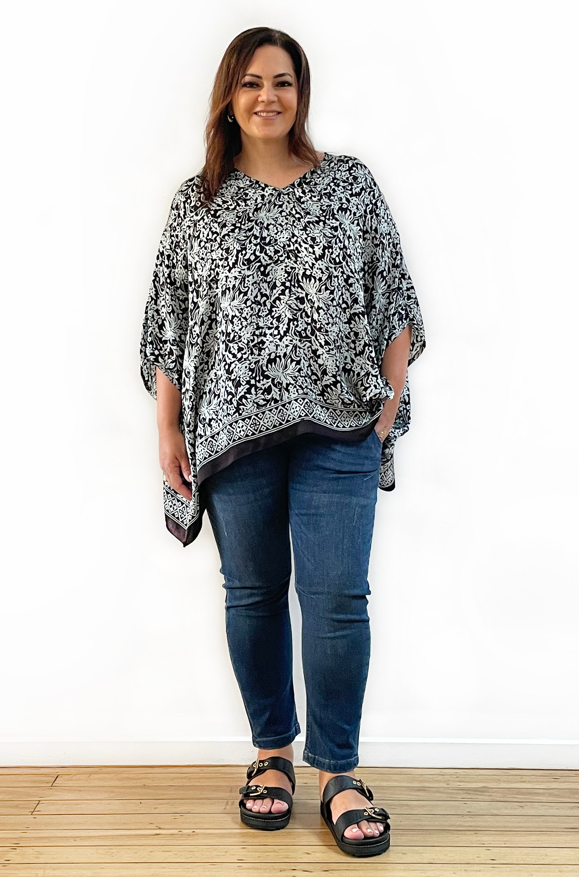 SILK PONCHO IN SOFT SAGE AND BLACK FLORAL PRINT