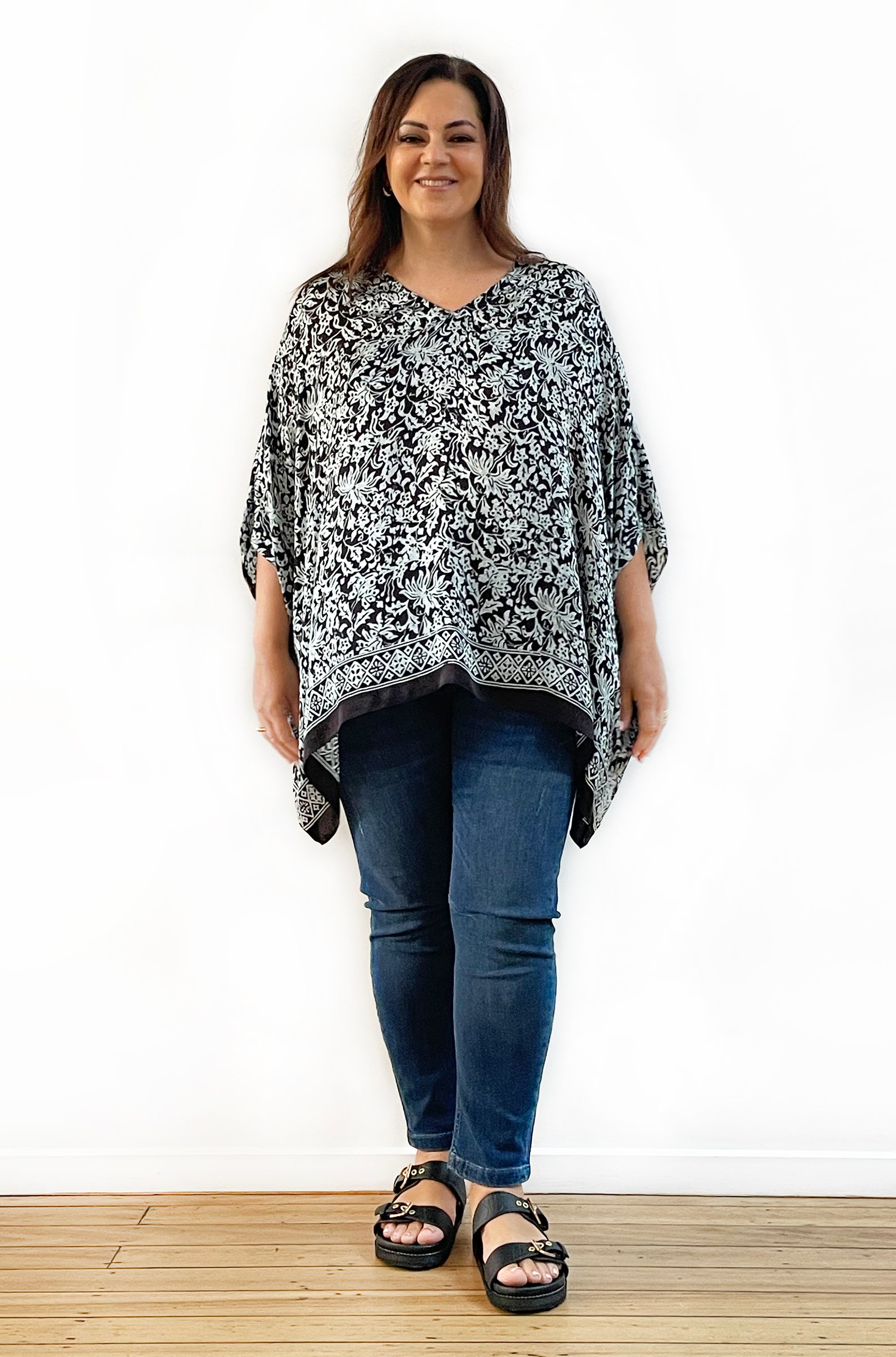 SILK PONCHO IN SOFT SAGE AND BLACK FLORAL PRINT