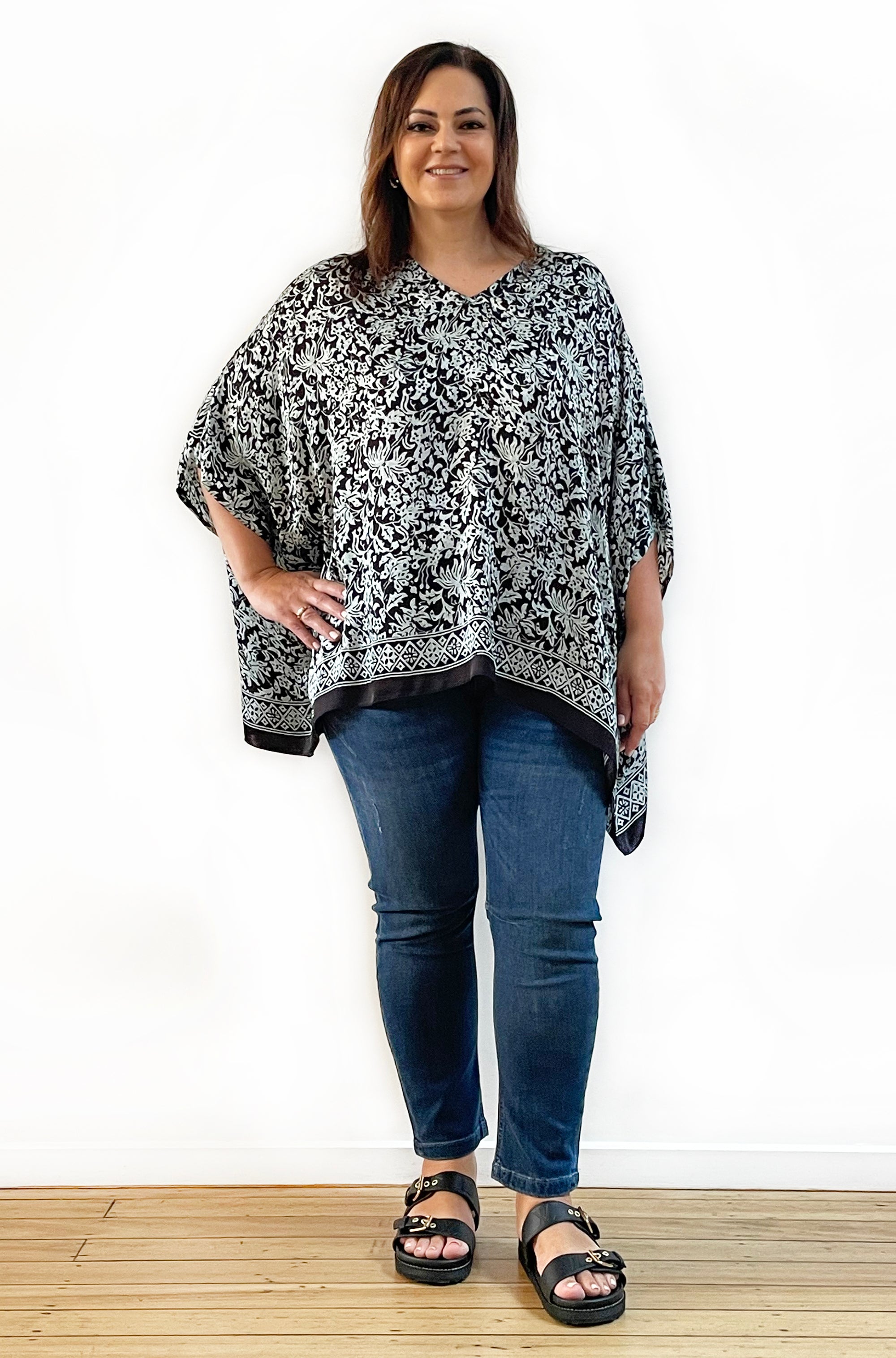 SILK PONCHO IN SOFT SAGE AND BLACK FLORAL PRINT