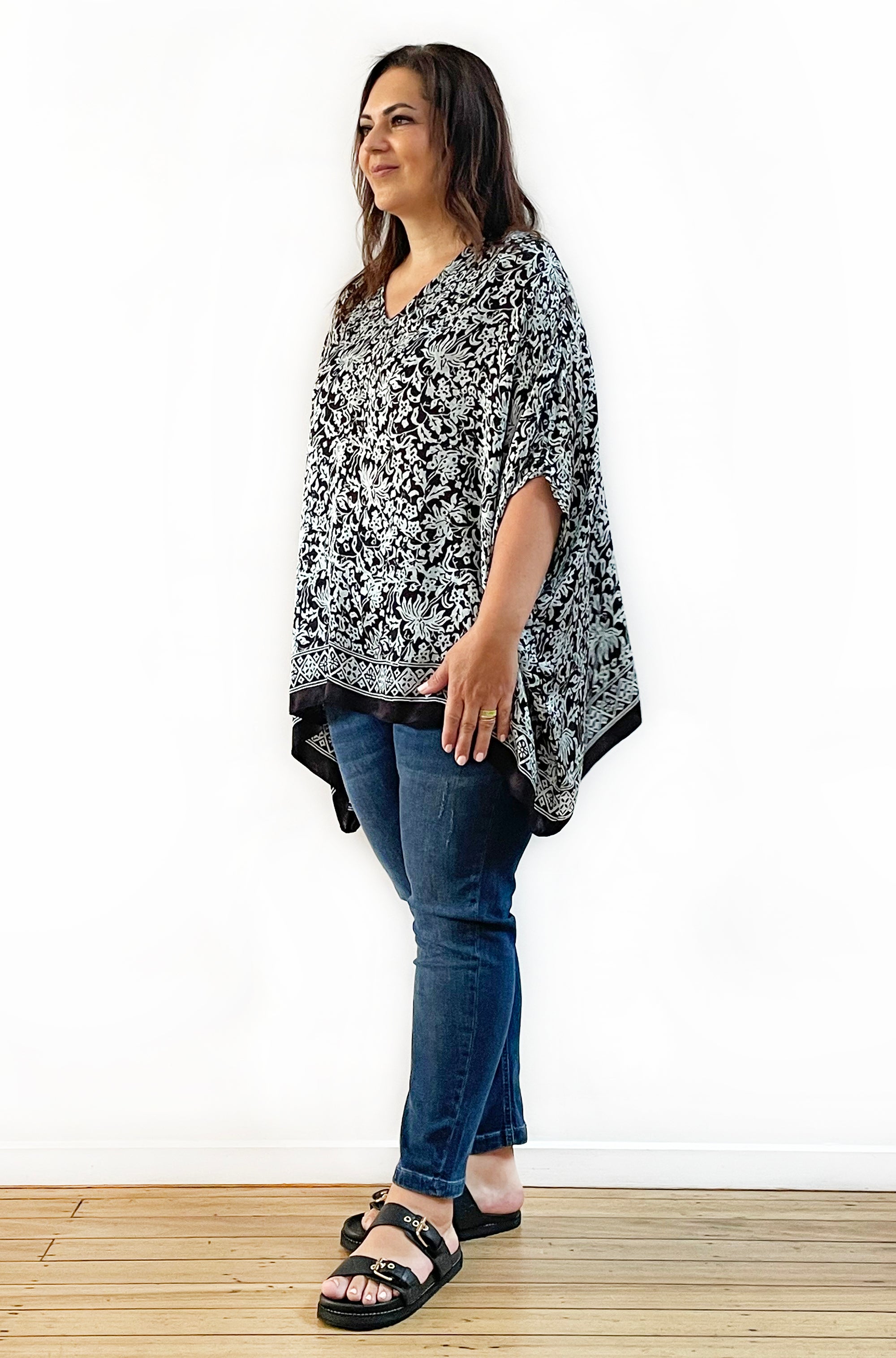 SILK PONCHO IN SOFT SAGE AND BLACK FLORAL PRINT