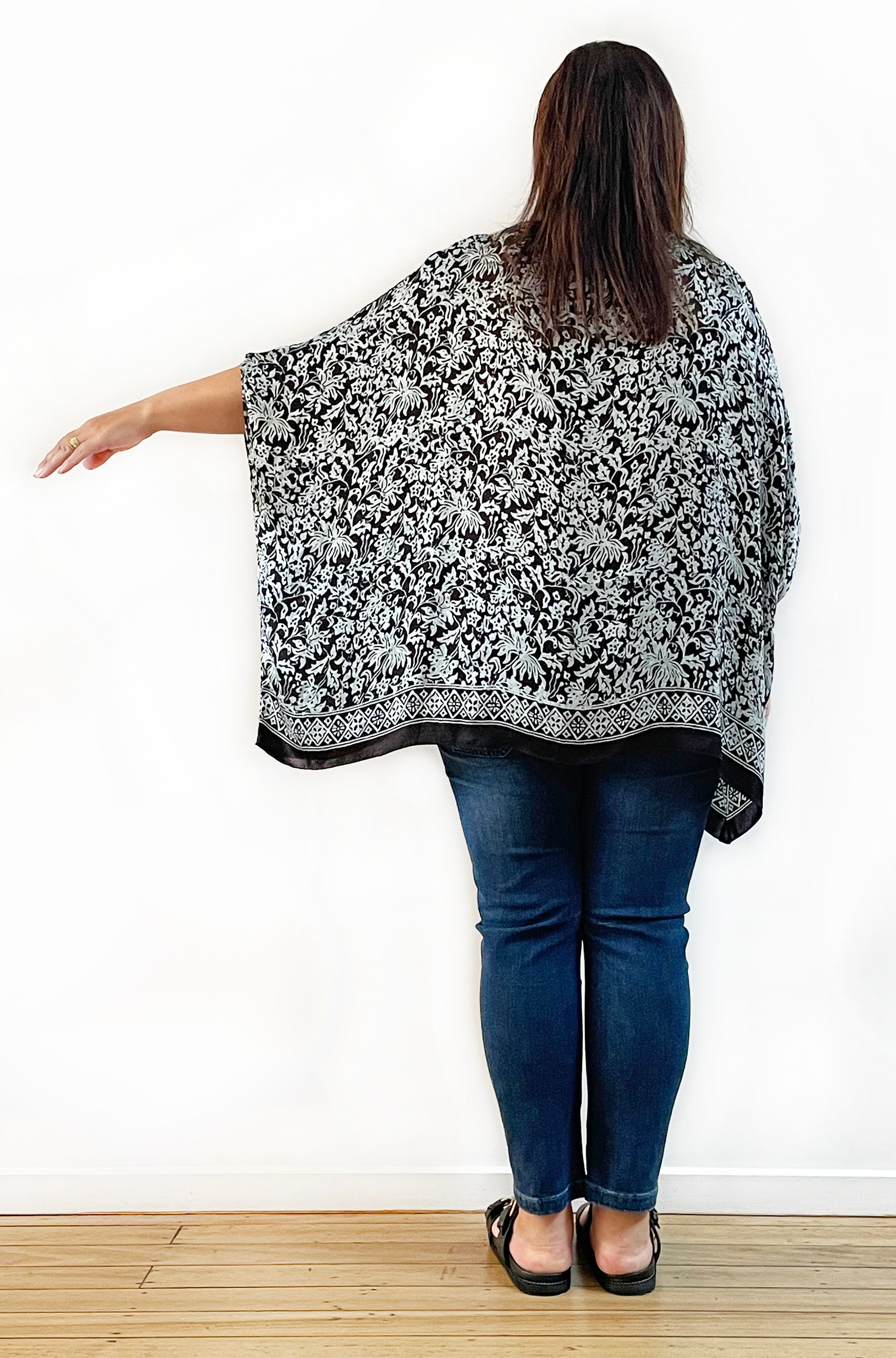 SILK PONCHO IN SOFT SAGE AND BLACK FLORAL PRINT